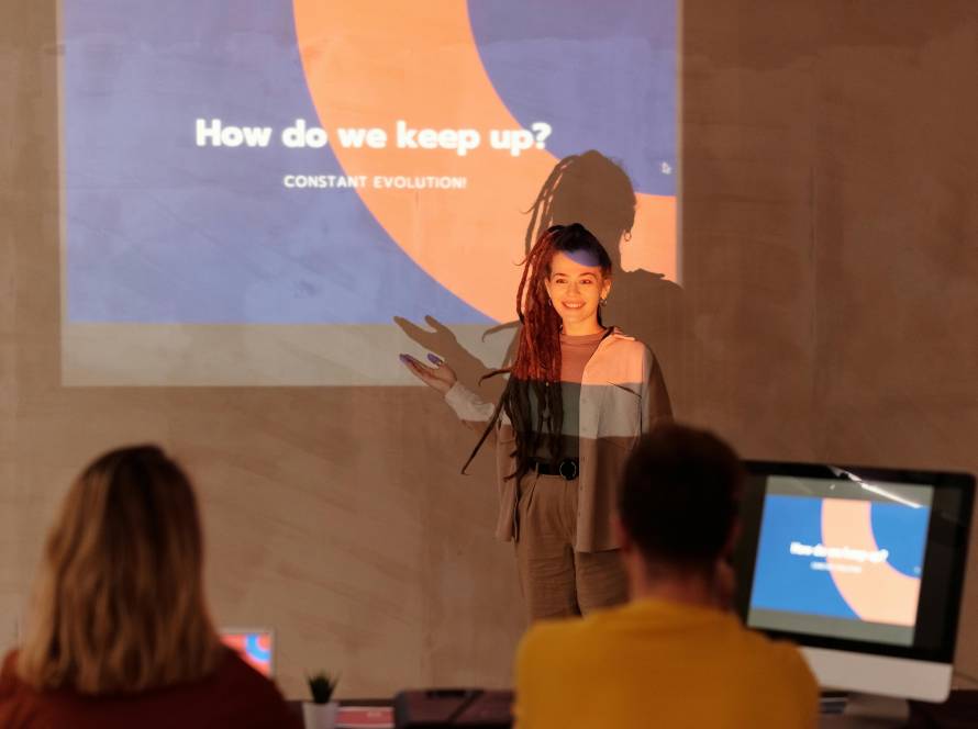 women explaining a topic while presenting